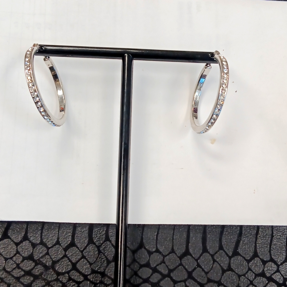 Round earrings with stones in them.Prices pay for groceries and even to start in